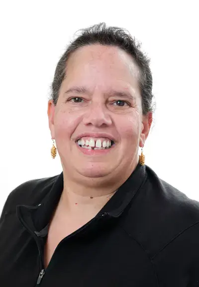 headshot of amy cook smiling at the camera