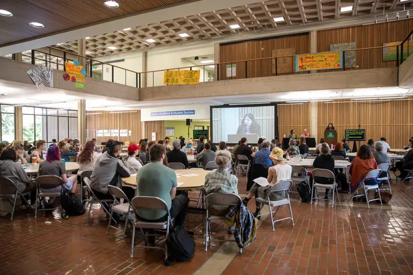 students, staff, and faculty gathered in Evans Hall Lobby for Farm Worker Justice Day