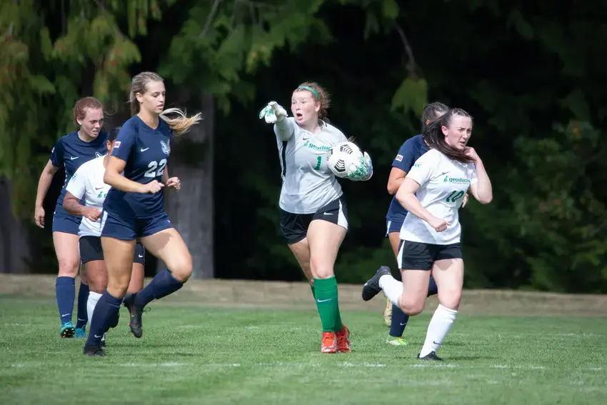 Womens soccer players during a game at The Evegreen State College