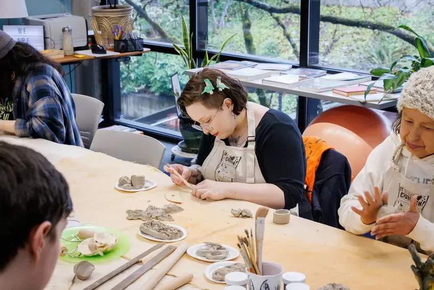 people in the social justice center crafting